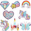 A collection of embroidered patches featuring unicorns and butterflies in various colors like purple, yellow, pink, and blue.