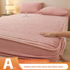 A pink rabbit velvet milk velvet strip fitted sheet on a bed.