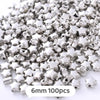 A pile of silver star-shaped metal beads, 6mm size, for jewelry making.