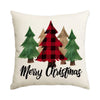 A cream-colored pillow featuring a plaid Christmas tree design with evergreen trees.