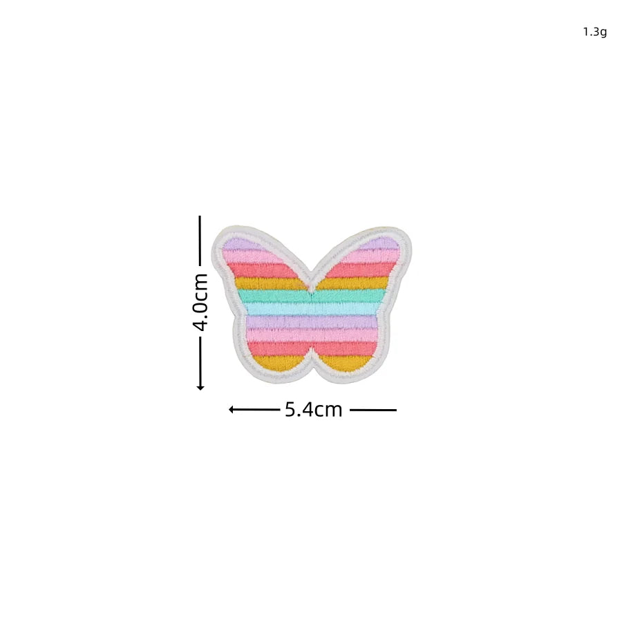 A set of ten embroidered butterfly patches in various pastel colors, including pink, yellow, green, and blue.
