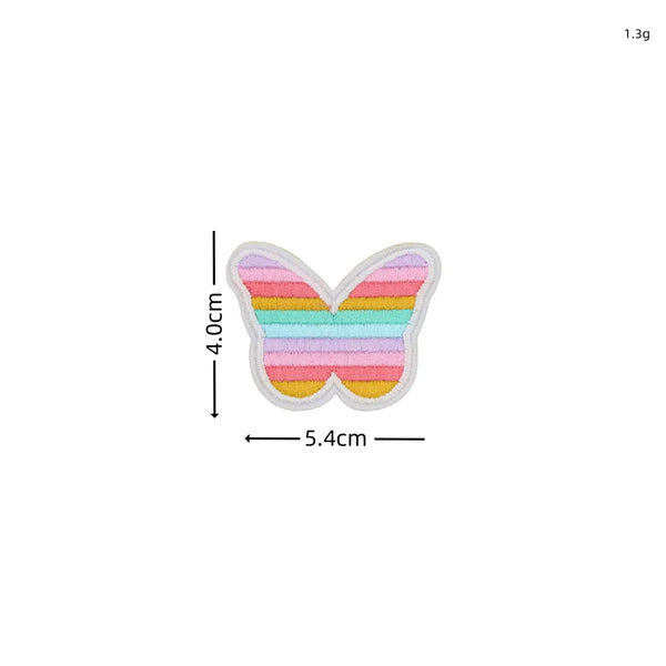 A set of ten embroidered butterfly patches in various pastel colors, including pink, yellow, green, and blue.