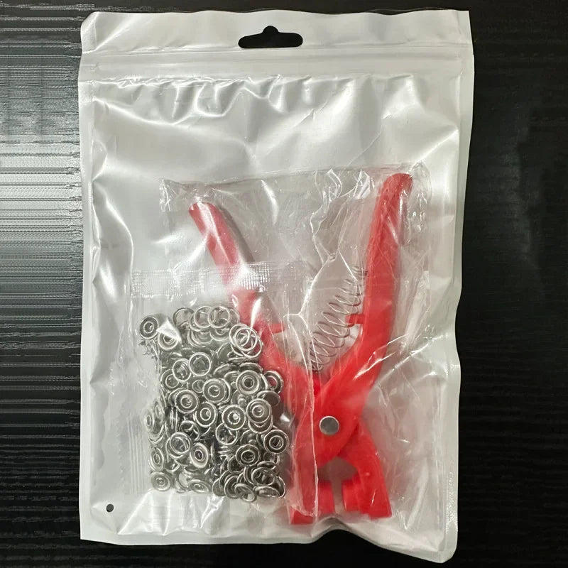 A clear plastic bag contains a set of red five claw buckle clamps for fabric and accessories.