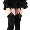 Black gothic lolita suspender socks with silver cross details and ruffled black skirt visible.