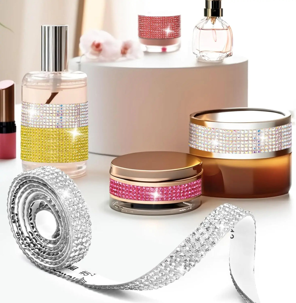 A set of crystal rhinestone ribbon and perfume bottles displayed on a white surface for DIY crafts.