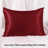 A deep burgundy satin pillowcase is shown against a white background.