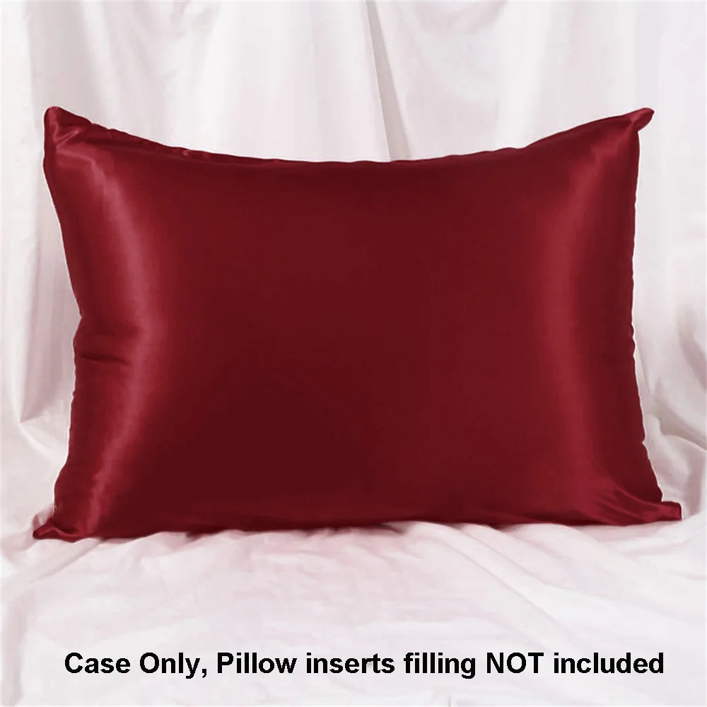 A deep burgundy satin pillowcase is shown against a white background.