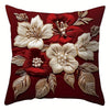 A deep red pillow cover featuring embroidered white and red floral designs.