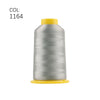 A spool of silver embroidery thread with a yellow cap.
