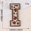 A black iron-on patch shaped like the letter I in leopard print on a white background.