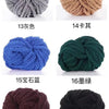 A collection of hand-woven chunky chenille yarn balls in various colors including gray, beige, blue, green, maroon, and black