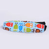 A colorful fabric head support for a baby car seat featuring cartoon owls and other woodland animals.