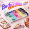 A box of resin and rhinestone materials for crafting, including glitter, beads, and decorative elements.