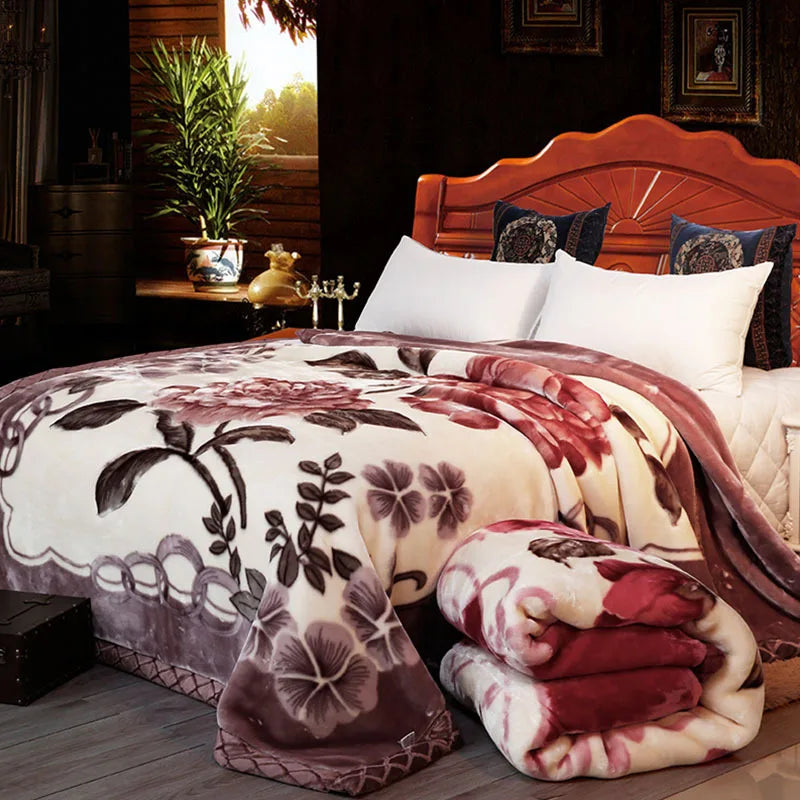 A plush mink fleece king size blanket with rose and peony floral pattern is displayed on a bed.