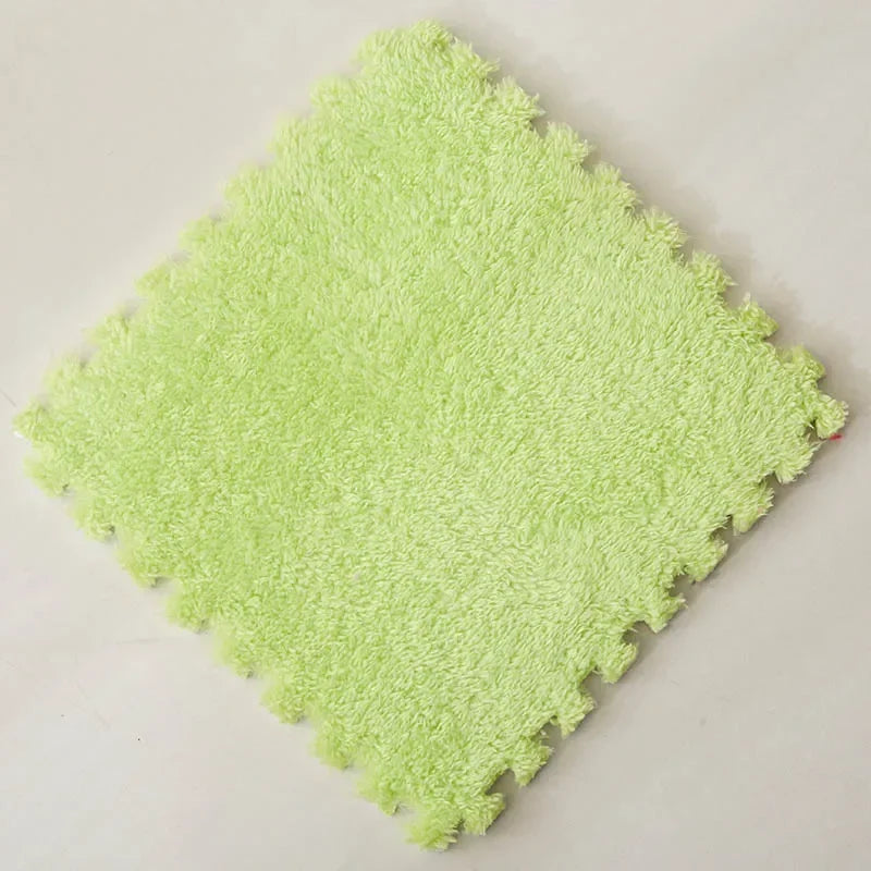 A square, light green plush interlocking puzzle rug mat.