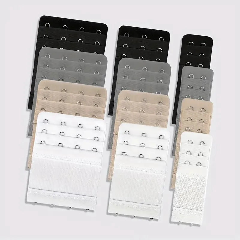 A set of adjustable bra extenders in various shades of gray and black are displayed.