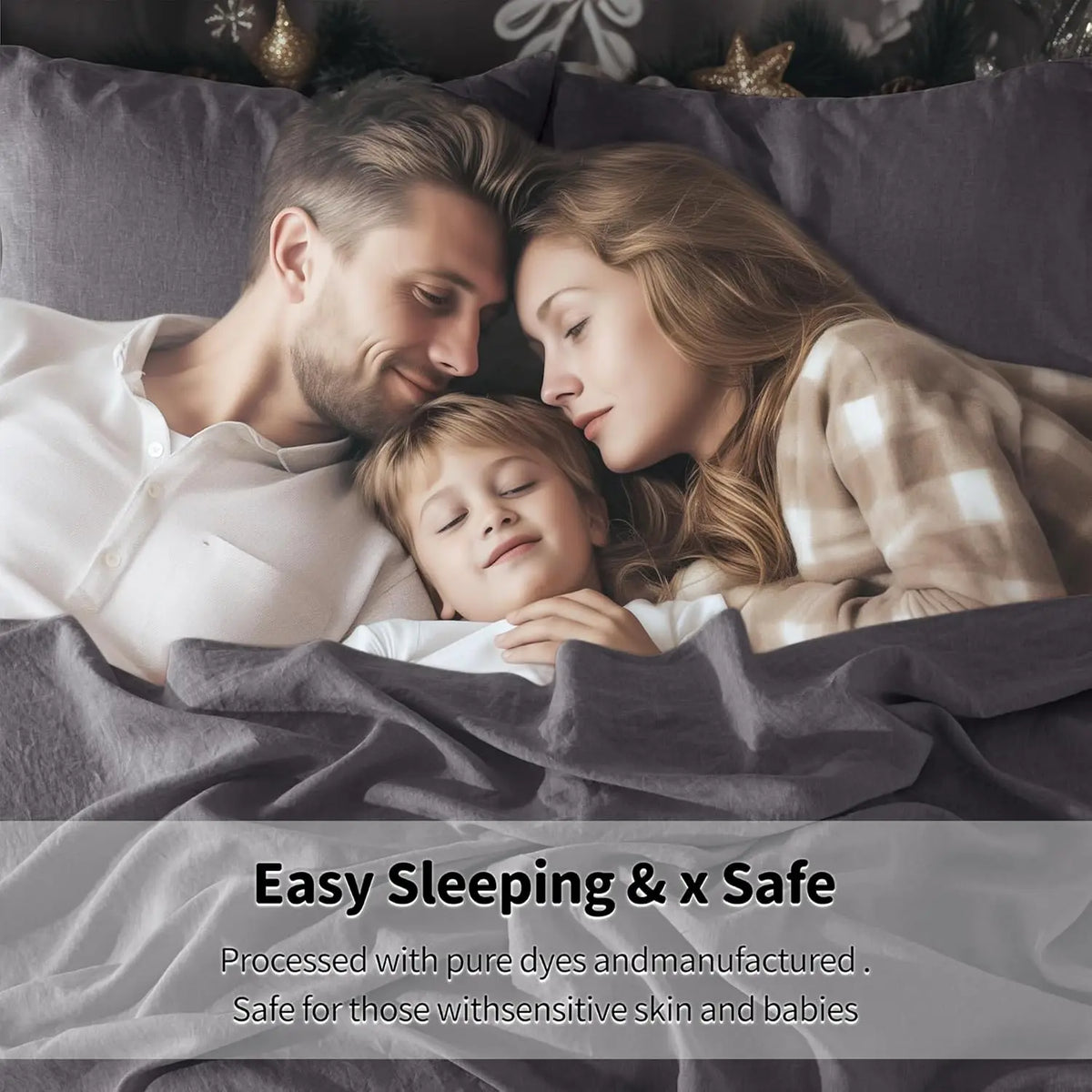 A family of three sleeping peacefully under a gray linen bedding set.