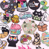 A collection of embroidered cartoon cat iron-on patches featuring various styles and expressions.