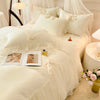 A luxurious white princess chiffon duvet cover set with ruffled details and sheer fabric accents.