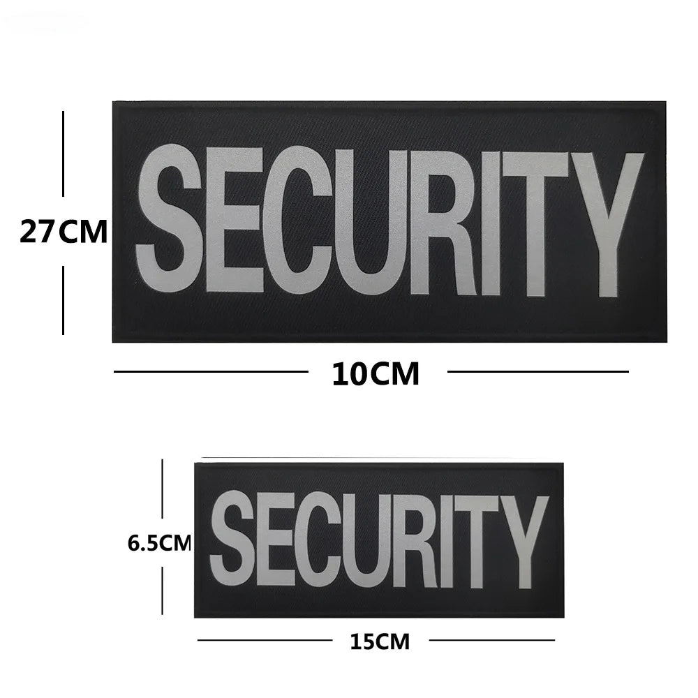 A black rectangular security patch with the word SECURITY embroidered in silver text.