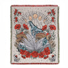 A hand-stitched throw blanket featuring a geometric floral design in red, orange, and earthy tones.