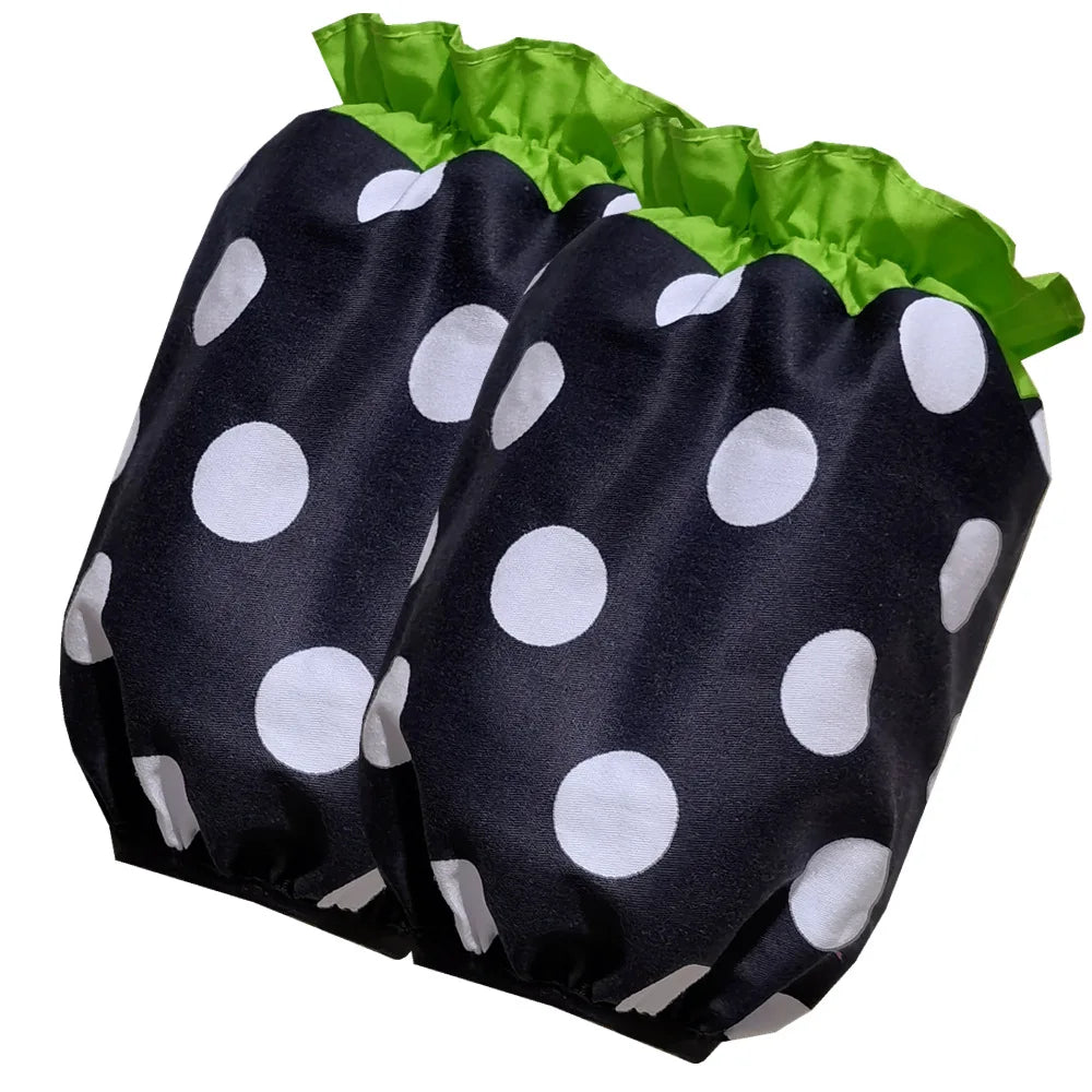 Black fabric ruffle apron with white polka dots and green trim