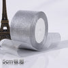 Roll of silver glitter organza ribbon for gift wrapping and DIY crafts