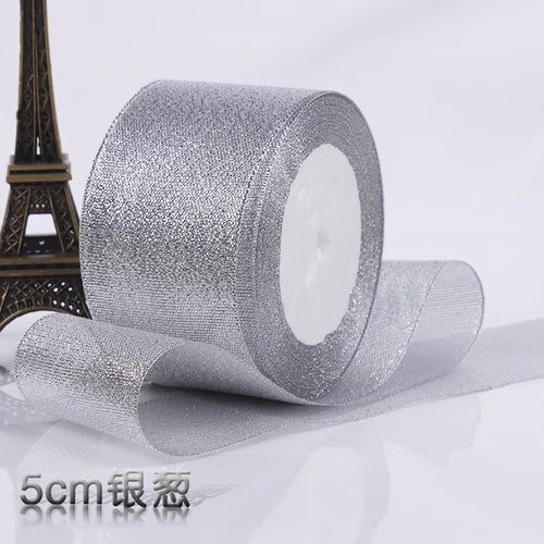 Roll of silver glitter organza ribbon for gift wrapping and DIY crafts