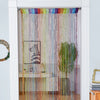 Decorative door string curtains with multicolored fringe hanging in a white frame.
