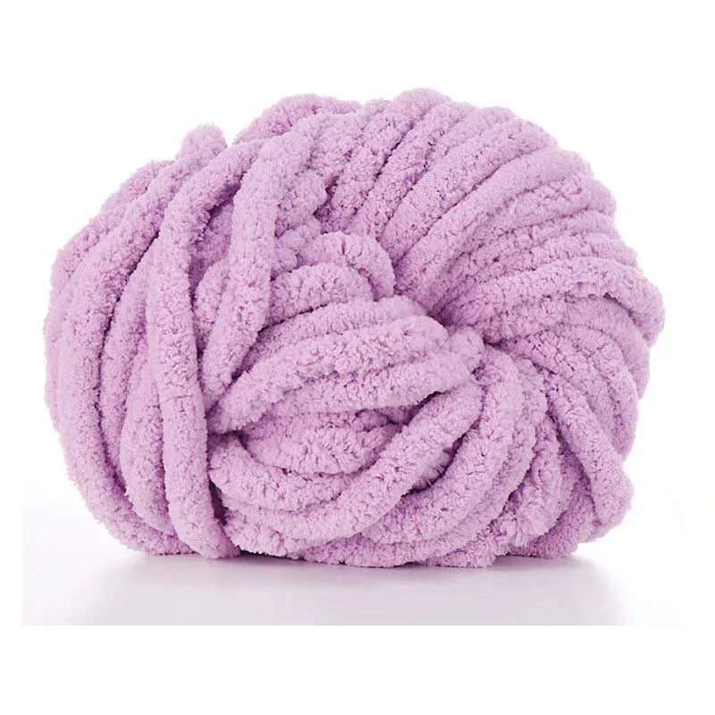 A ball of fluffy lavender chunky acrylic yarn for knitting and crochet projects.