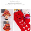 Close-up of bright red knitted yarn and finished fabric pieces showing various textures and patterns.