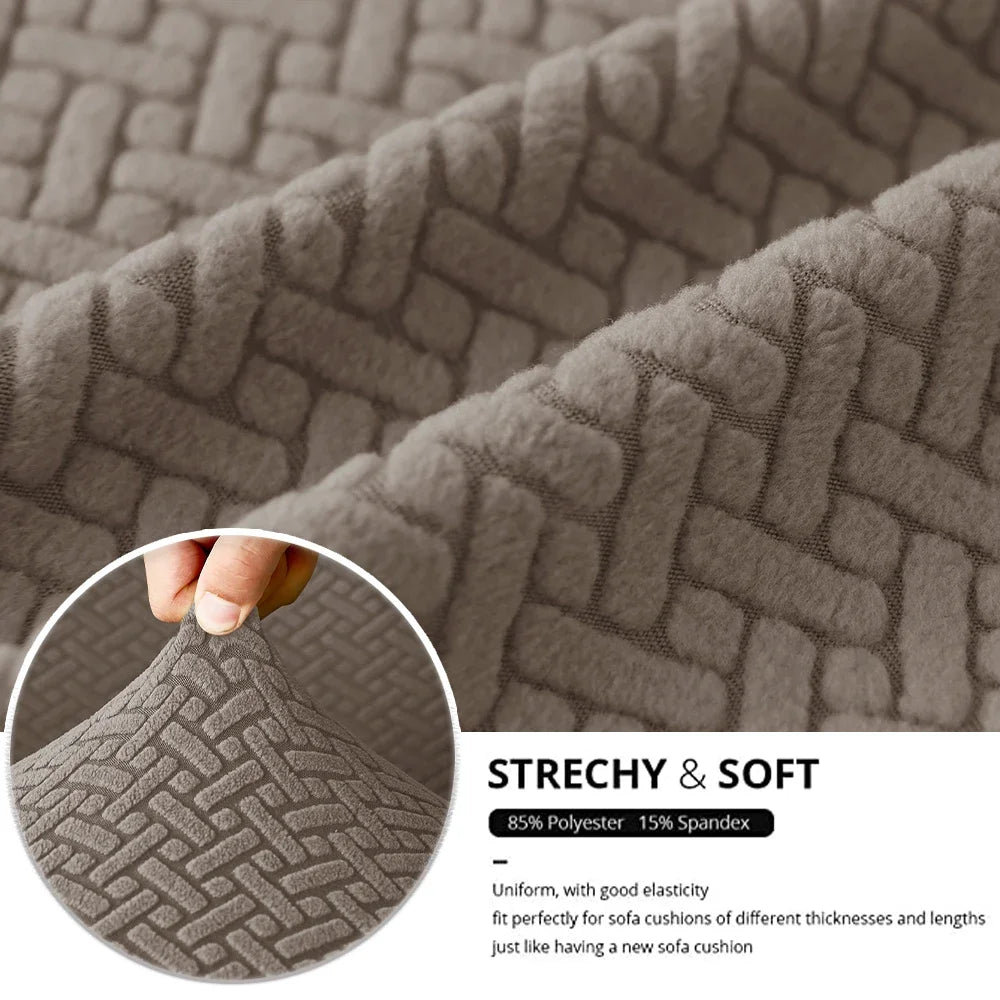 Close-up of a textured gray stretch fabric seat cover showing its woven pattern and soft texture.