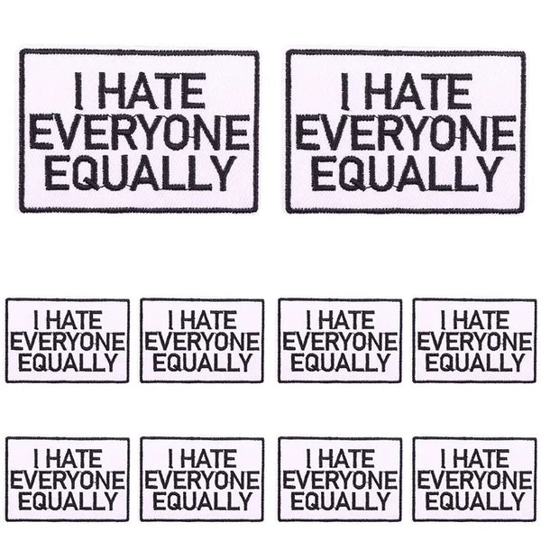 Four square patches with embroidered text that reads I HATE EVERYONE EQUALLY