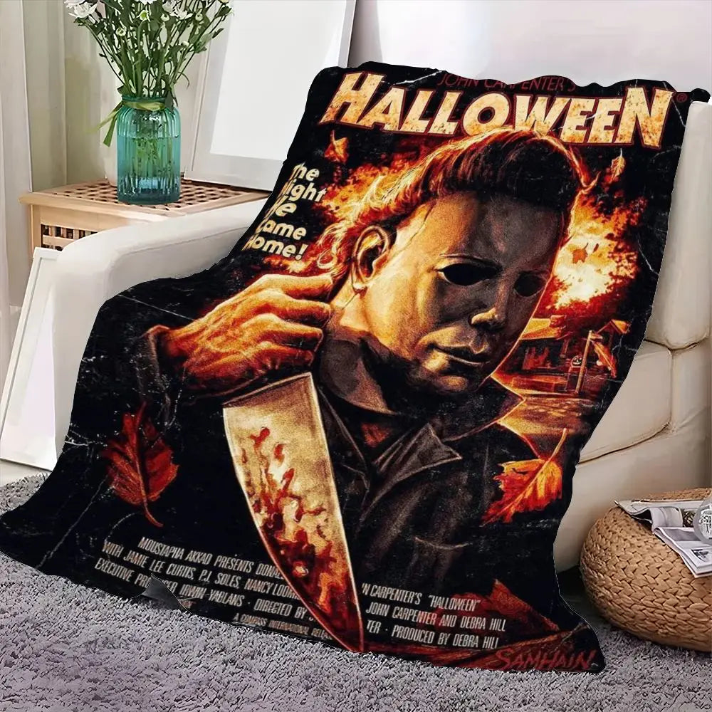 A dark Halloween themed blanket featuring a dramatic portrait of a man with fiery hair and intense expression.