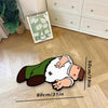 A cartoon-themed soft area rug depicting a person lying down, with a flower market sign in the background.