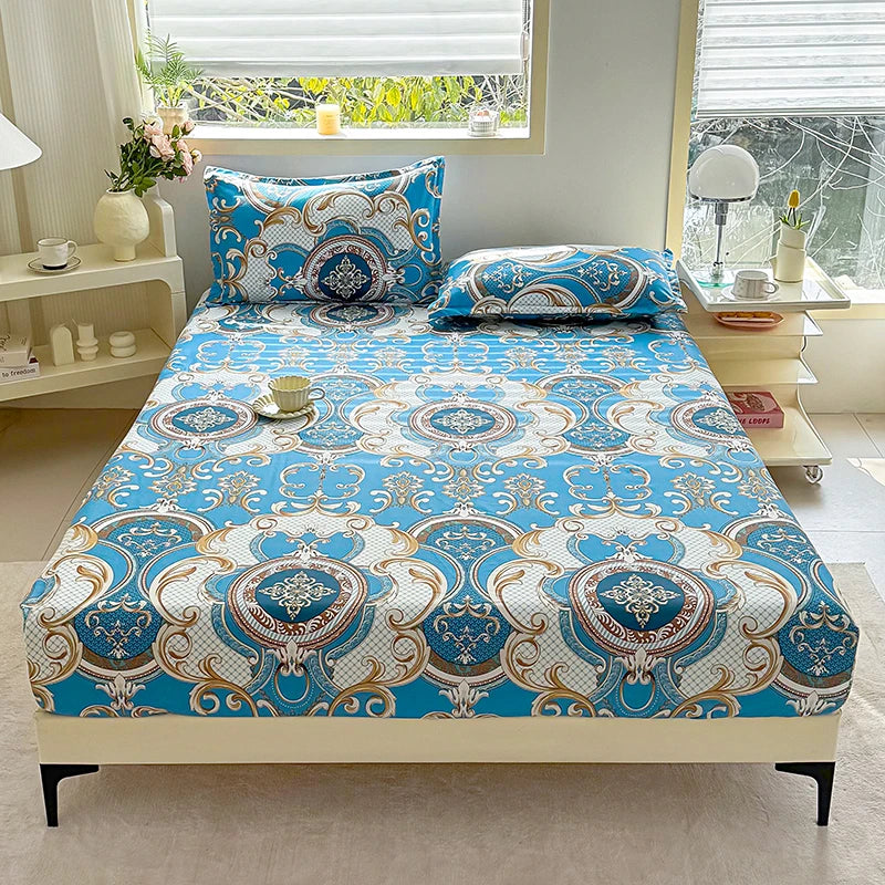A fitted bed sheet with a blue and white floral print displayed on a bed.