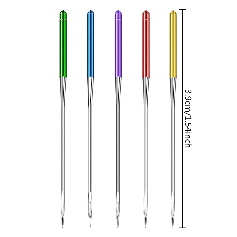 A set of precision sewing machine anti-jump needles in green, blue, and purple, shown vertically.