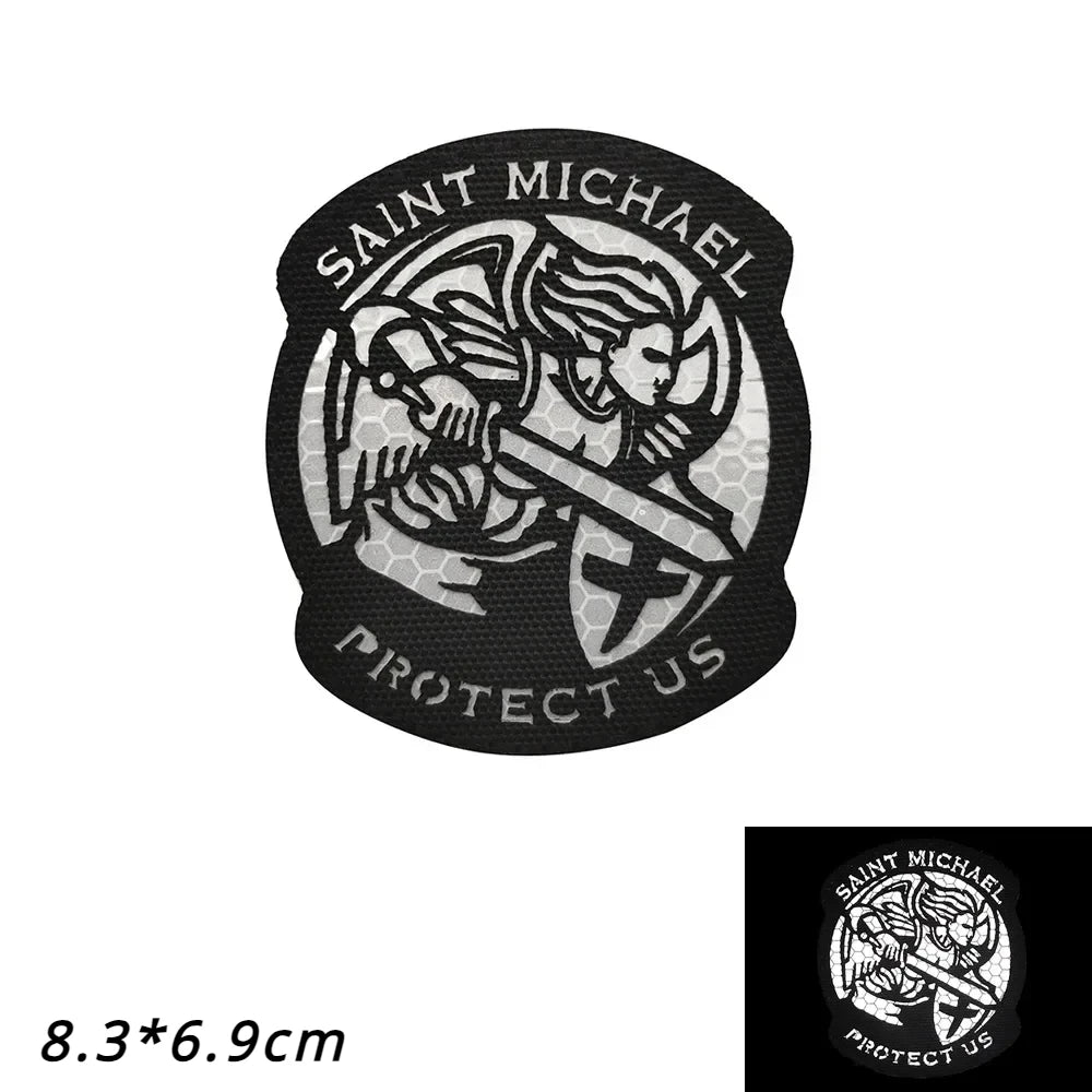 Black embroidered patch featuring a winged angel design and the text SAINT MICHAEL PROTECT US