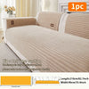 A beige minimalist anti-slip sofa cushion shown on a white sofa with matching striped back cushions.