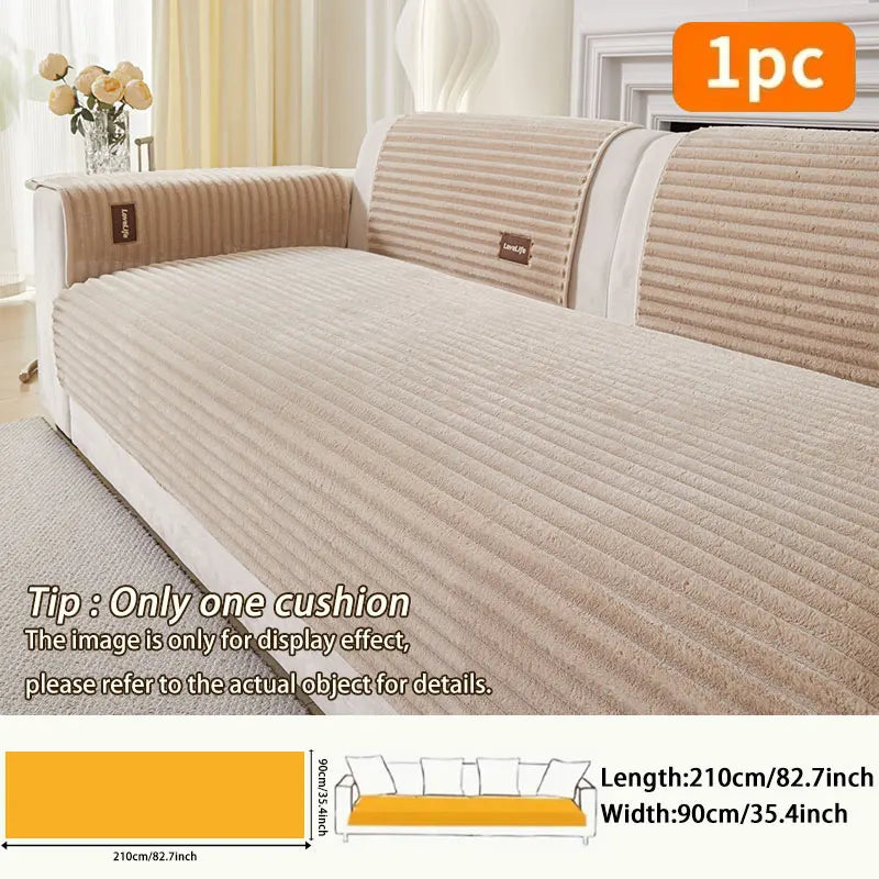 A beige minimalist anti-slip sofa cushion shown on a white sofa with matching striped back cushions.