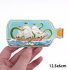 Embroidered iron-on patch featuring a cartoon cat and sea creatures on a light blue background