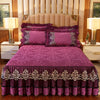 A purple bed skirt set with matching pillowcases and a padded headboard in a bedroom setting.