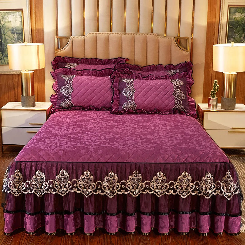 A purple bed skirt set with matching pillowcases and a padded headboard in a bedroom setting.