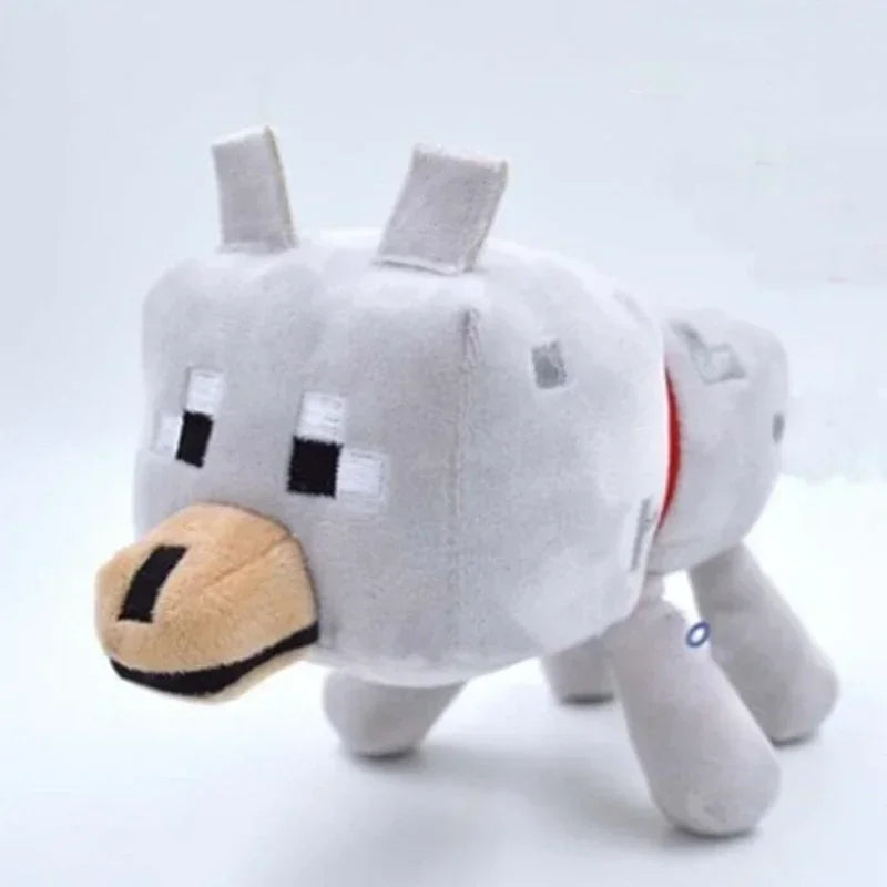 A gray stuffed dragon plush toy with small horns and a snout.