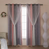 Grey and pink gradient star perforated curtains hanging in a window frame.