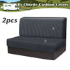 Two gray stretchable cushion covers for an RV dinette seat shown next to a white van.