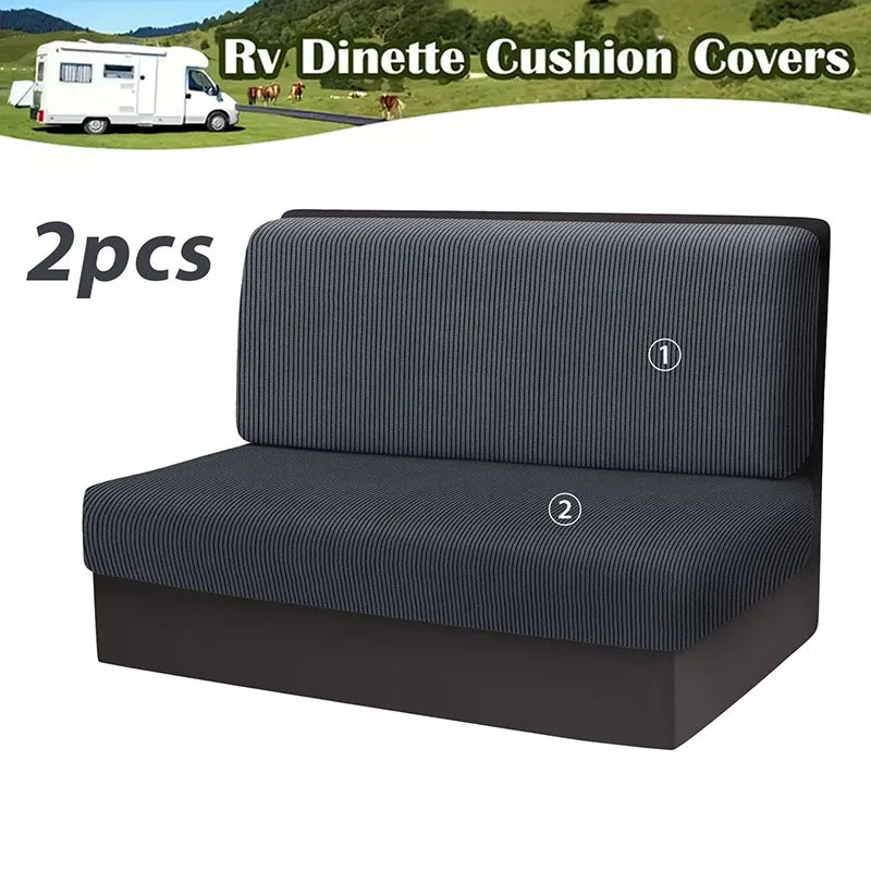 Two gray stretchable cushion covers for an RV dinette seat shown next to a white van.