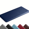 A dark blue anti-fatigue PVC kitchen mat shown from above.