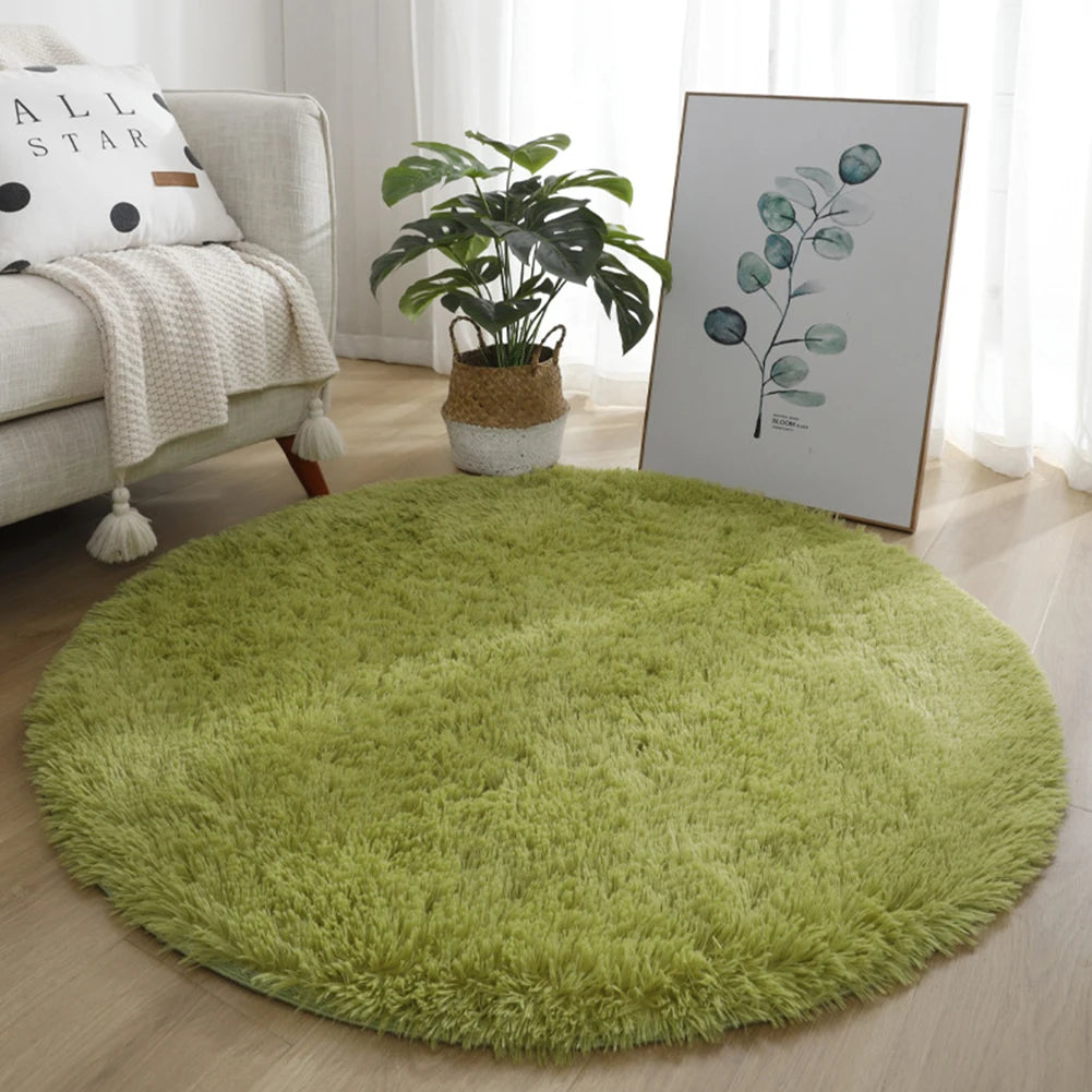 A round, bright green shaggy area rug placed on a light wood floor next to a sofa and a potted plant.