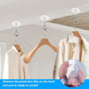 A set of heavy duty self-adhesive ceiling hooks being installed on a white ceiling, with a close-up showing the protective fi